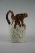 A late 19th Century Staffordshire pottery two tone jug of octagonal form with scrolled handle and