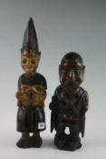 Two Native hardwood figures, one of a tribal lady wearing headdress, the other of a gentleman 19.