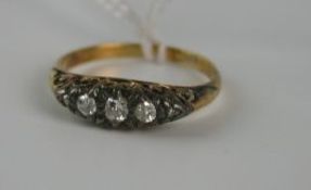 Early twentieth century gold (unmarked) diamond five stone dress ring with five graduated old cut