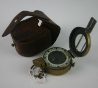 An early twentieth century brass compass by Stanley of London marked 81/805 with leather case marked