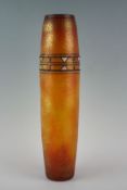 An early 20th Century vase of elliptical shape with burnt orange and gilt background and black and