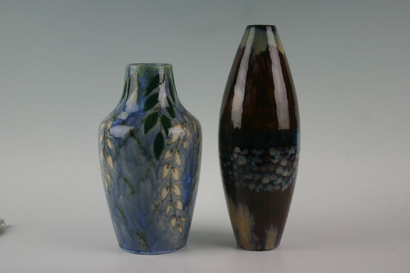 Two Cobridge stoneware vases, one with bottle neck and mottled and floral glaze, the other of