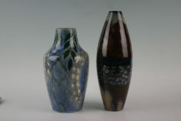 Two Cobridge stoneware vases, one with bottle neck and mottled and floral glaze, the other of