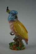 A Beswick ceramic figurine of a cockatoo, serial number 1180, 8.25 ins (21 cms) high