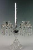 A Waterford cut glass two branch candlestick in the style of a Victorian lustre with circular