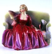 A Royal Doulton seated figure `Sweet and Twenty` HN1610