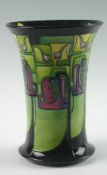 An Emma Bossons Moorcroft pottery vase of geometric stylised floral design in hues of green,