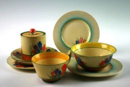 A group of Clarice Cliff `Crocus` pattern teaware; including tea cup and saucer, sugar bowl and