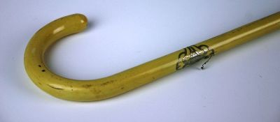 An early twentieth century ivory walking cane made from one piece of ivory, with white metal