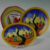 A large collection of Clarice Cliff inspired plates. Various measurements