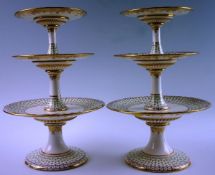 A pair of fine 19th Century three tier cake stands each with stepped circular bases decorated with