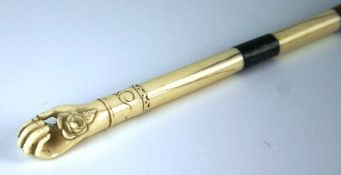 A ladies` Victorian ivory and bamboo walking stick with ivory carved handle in the form of a hand