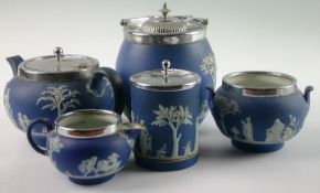 A group of five Wedgwood Jasperware blue and white teaware items, comprising teapot, biscuit barrel,