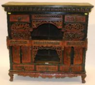 A painted 19th Century Oriental carved wood altar table of architectural design with balustraded