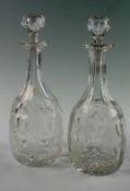 A pair of Victorian acid etched decanters with stoppers, of bulbous form with star cut bases, fluted