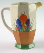 A Clarice Cliff `Crocus` pattern milk jug of octagonal form with polychrome floral decoration. 7` (