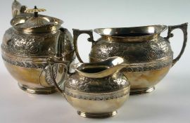 A three piece Victorian silver plate tea service. Of oval compressed form with scrolled rococo