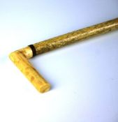 A ladies` Edwardian ivory walking stick with tapered cylindrical stick, mahogany collar and