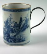 An early nineteenth century underglazed blue cylindrical pot with attached metal handle. 6 ins (15