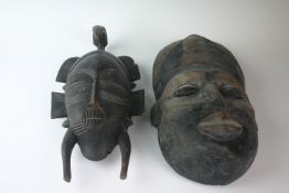 Two circa 1950s African tribal masks used for the Bunnbio tribal ceremony.