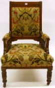 An Edwardian parlour chair with oak frame, peacock and fauna patterned fabric to cushioned back