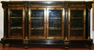 A fine 19th Century ormolu mounted ebonised and boulle side cabinet, the front with two glass