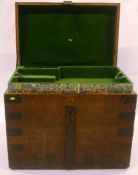 A circa 1836 oak and metal trunk with applied metal supports, handles to sides, opening to reveal