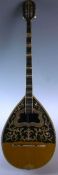 An early nineteenth century Bouzouki (Tetrachordo) with olive wood inlaid bowl-back, mother of