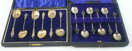 Two cased sets of George V silver spoons. Comprising; a set of six apostle spoons with shell gilt