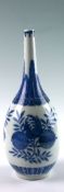 A nineteenth century Chinese blue and white bottle vase with three pomegranate blossoms bordered