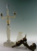 A mid 20th Century moulded glass candlestick of Oriental design with caryatid column on circular
