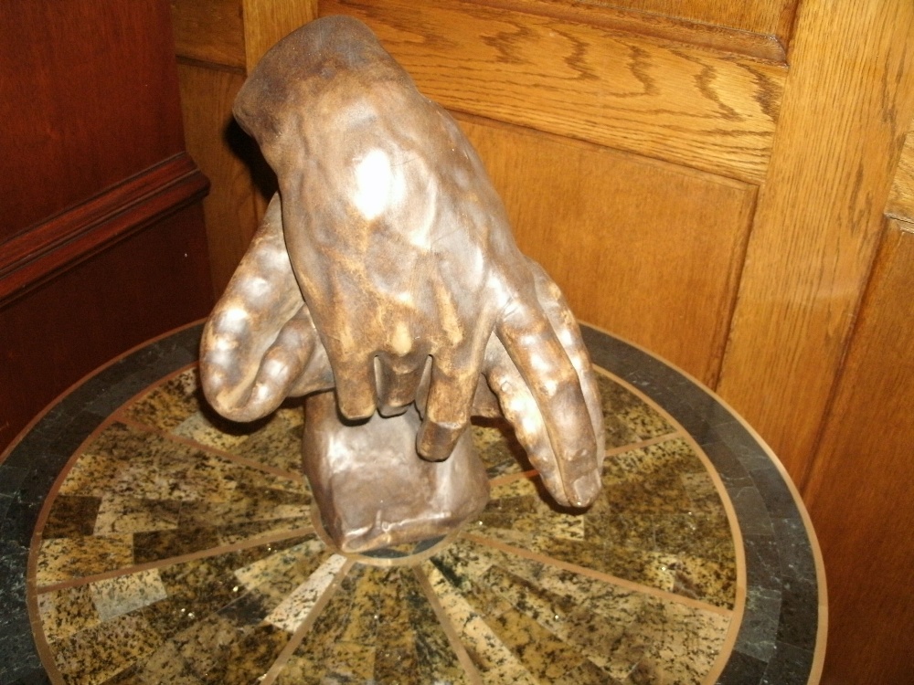 A resin bronze study of a resting hand