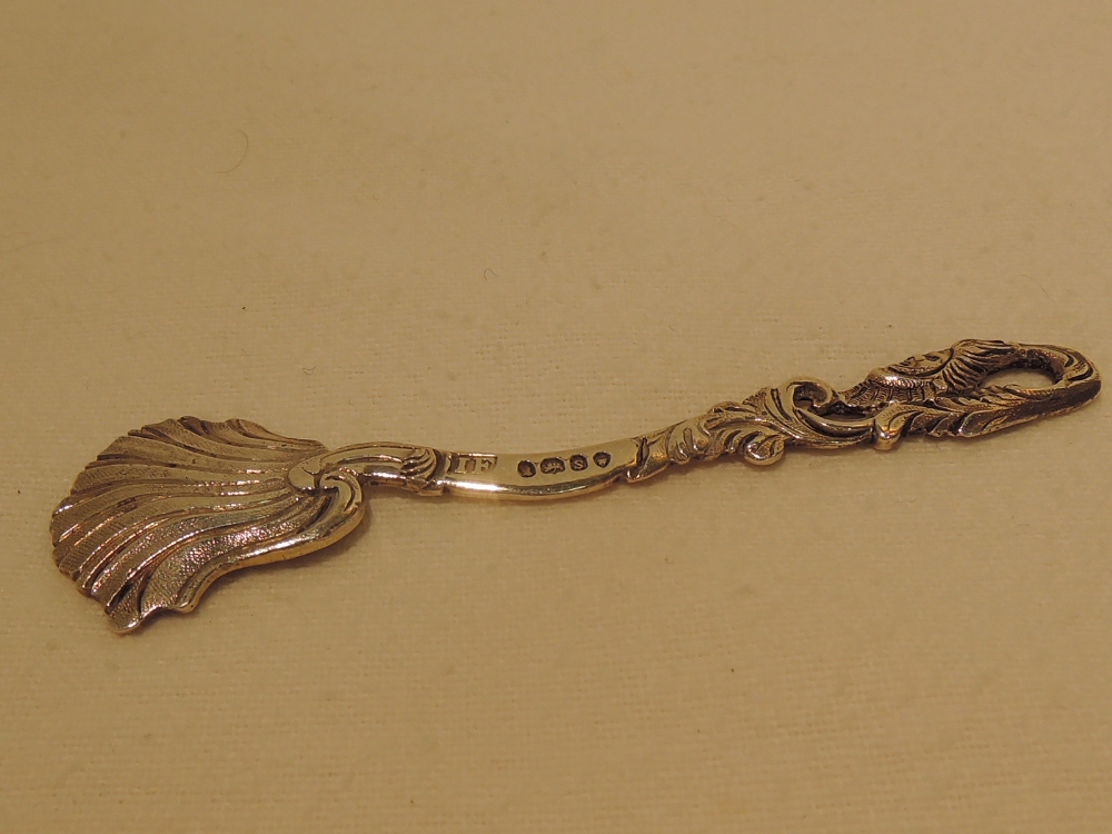 A silver spoon, of decorative form, leaf and mythological decoration, London 1833, John Fry II