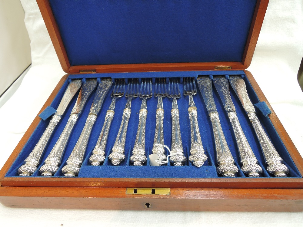 A canteen of silver plated fish knives and forks of ornate pattern and another canteen of silver
