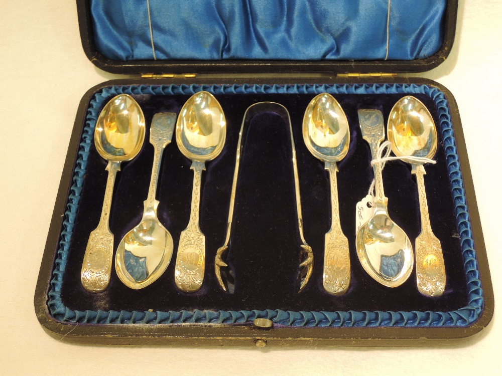 A cased set of 6 silver teaspoons and sugar tongs, Sheffield 1900, Atkin Bros