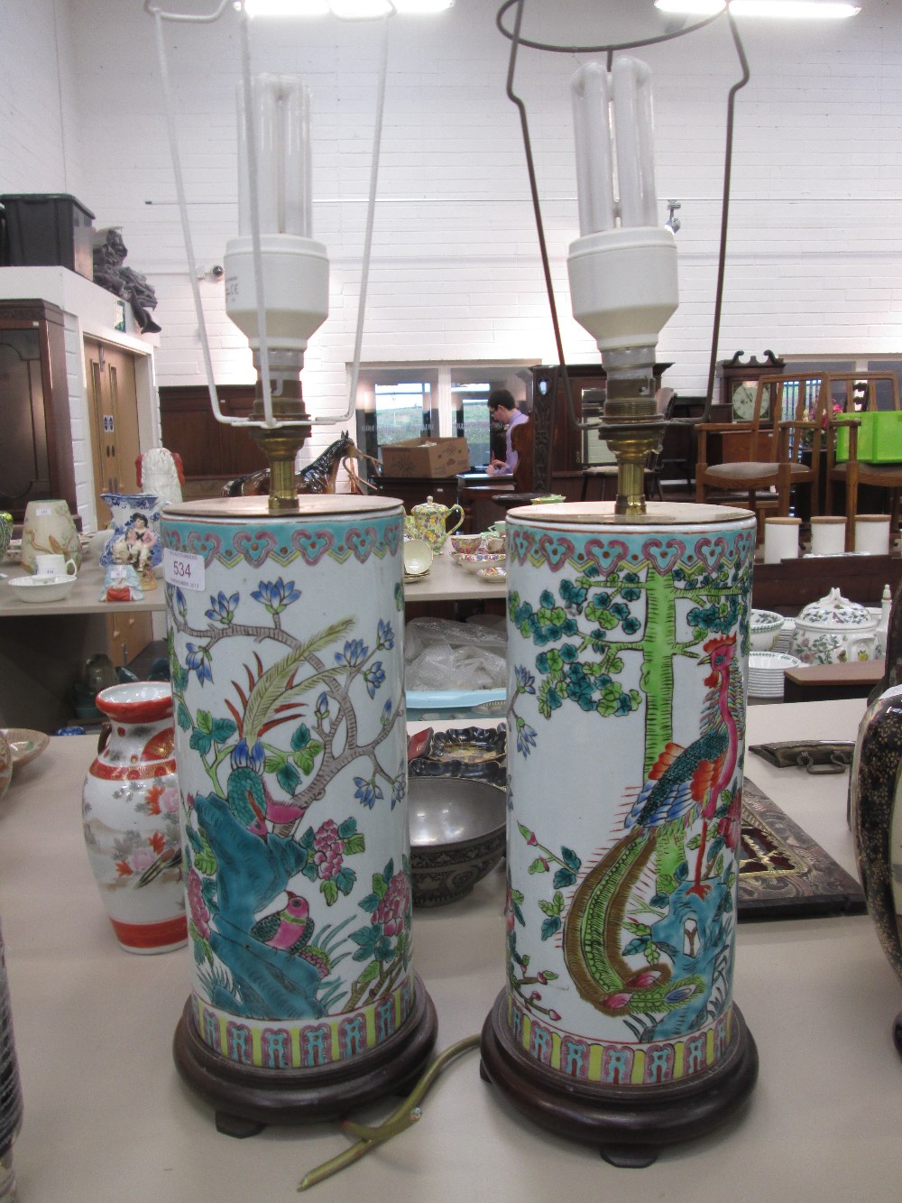 A pair of 20th century Chinese cylindrical vases/lamps having polychrome pictorial naturalistic