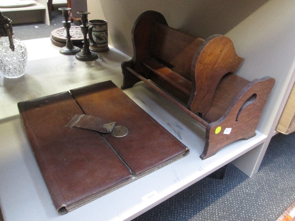 Two early 20th century treen bookstands, and a leather portfolio