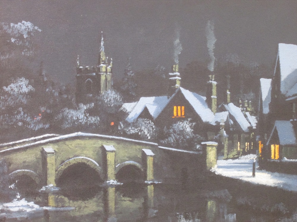 An oil painting, Alan King, Snow covered village, Castle Combe, signed, dated 1987 and attributed