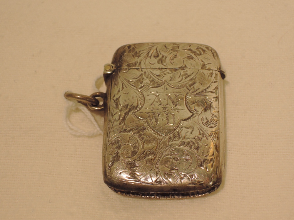 A silver vesta, having foliate decoration, Chester 1903, E J Trevitt & Son