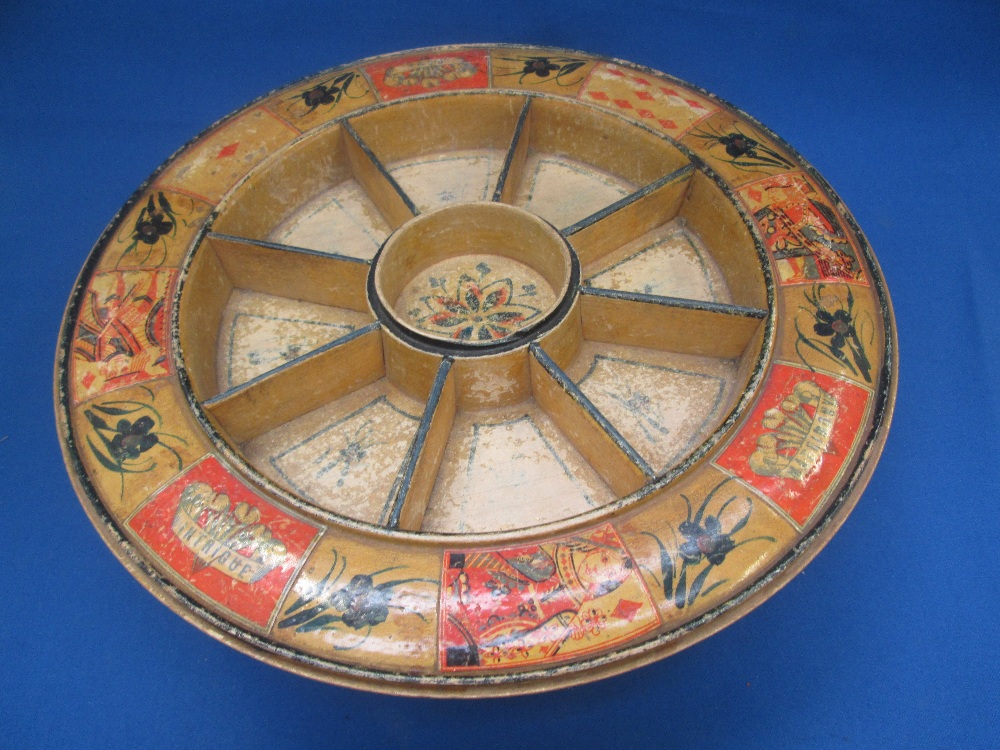 An early 20th century treen circular compartmented revolving bowl game, `Matrimony and Intrigue`