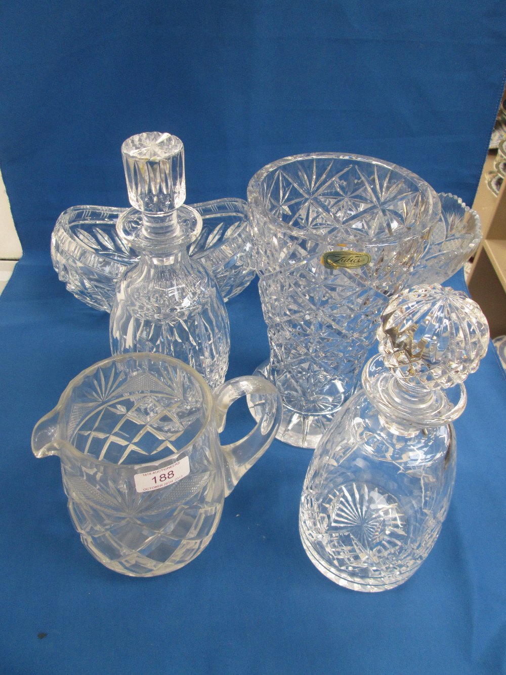 A selection of cut glass including vase, decanters, coloured glass tumblers etc