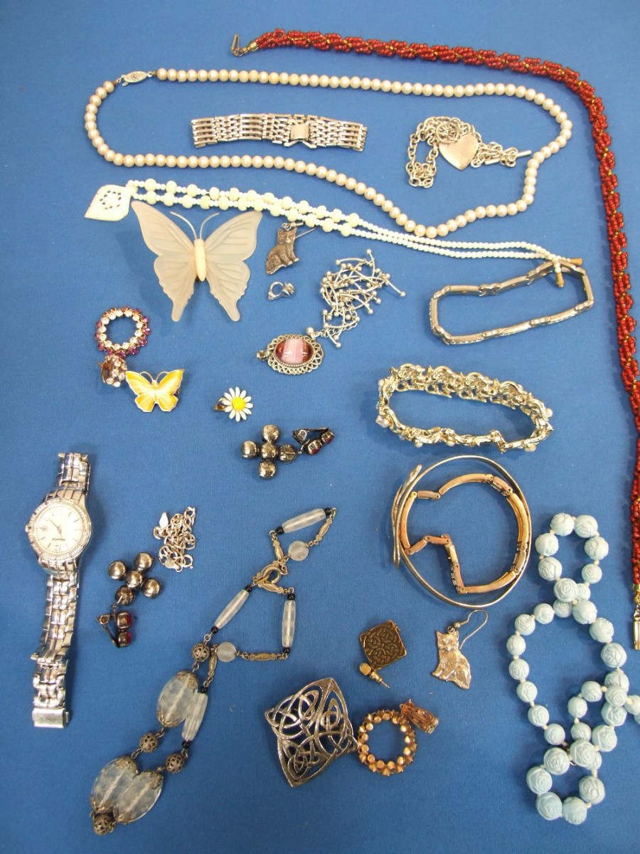A tray of costume jewellery including white metal `cat` earrings, Accurist watch etc