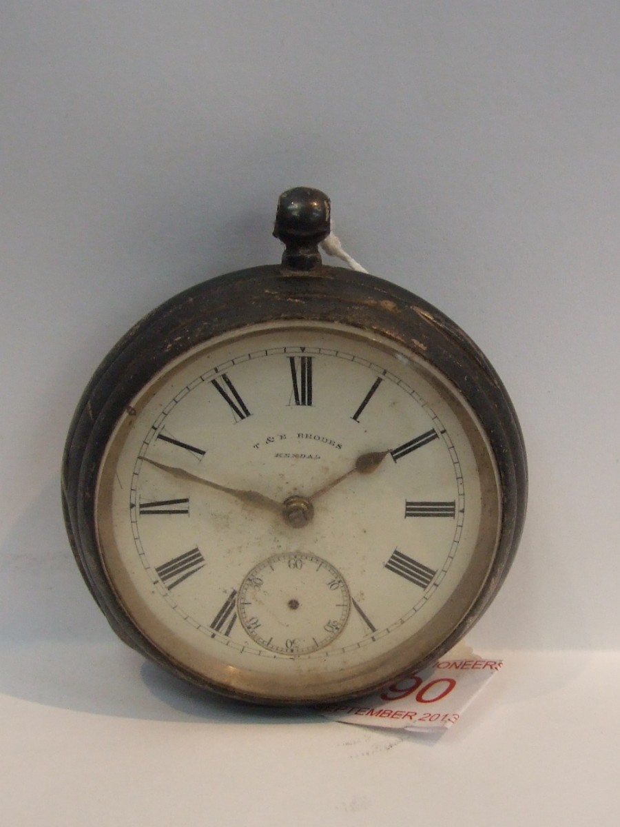 A key wound silver pocket watch by T & E Rhodes, Kendal having Roman numeral dial and subsidiary