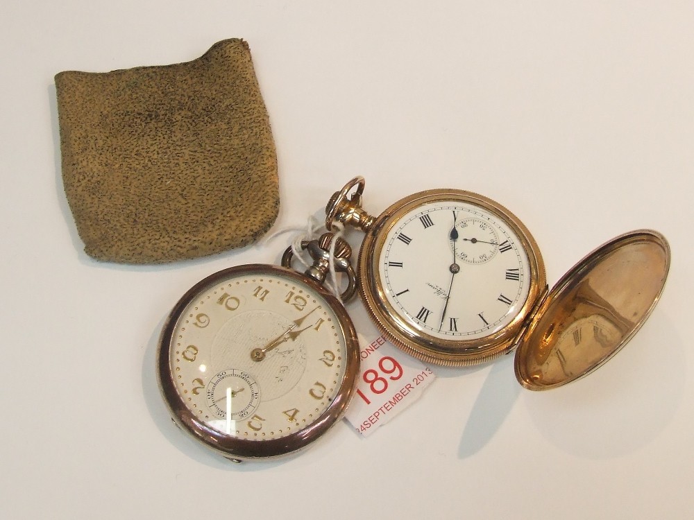 A gold plated full hunter pocket watch by Waltham having Roman numeral dial and subsidiary seconds