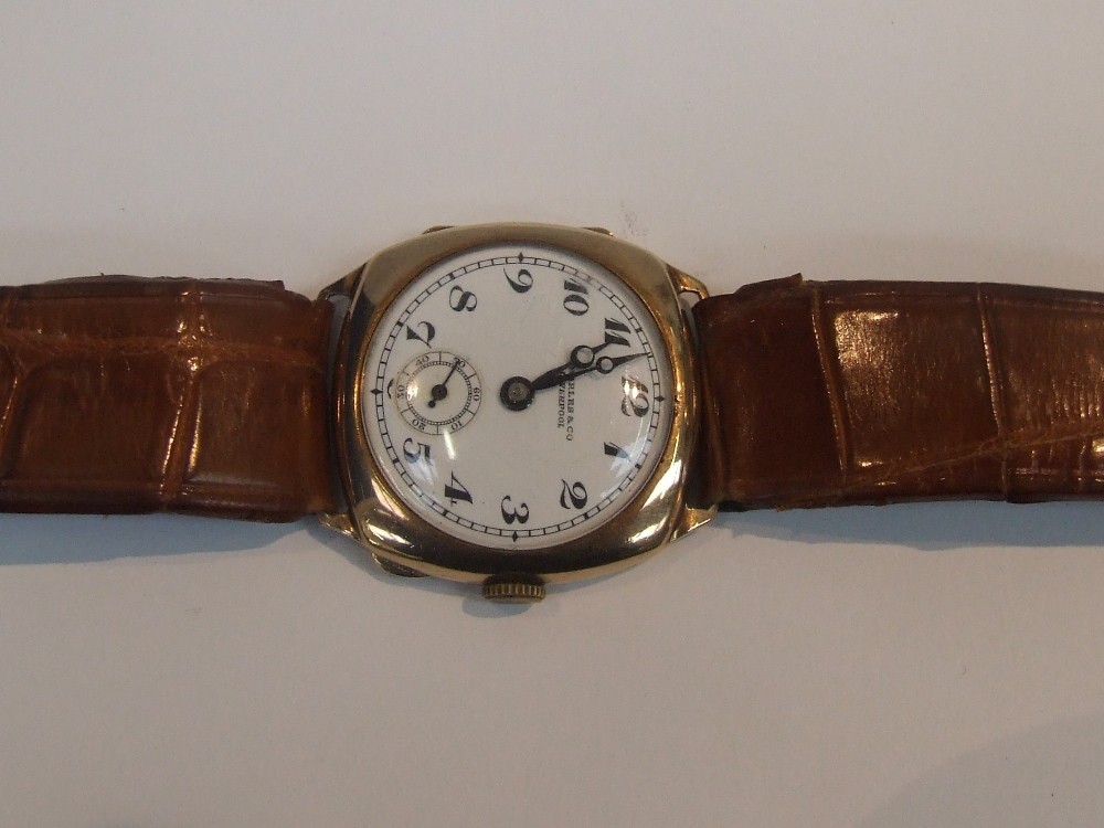 A gents wrist watch by Charles & Co of Liverpool having Arabic numeric dial and subsidiary seconds