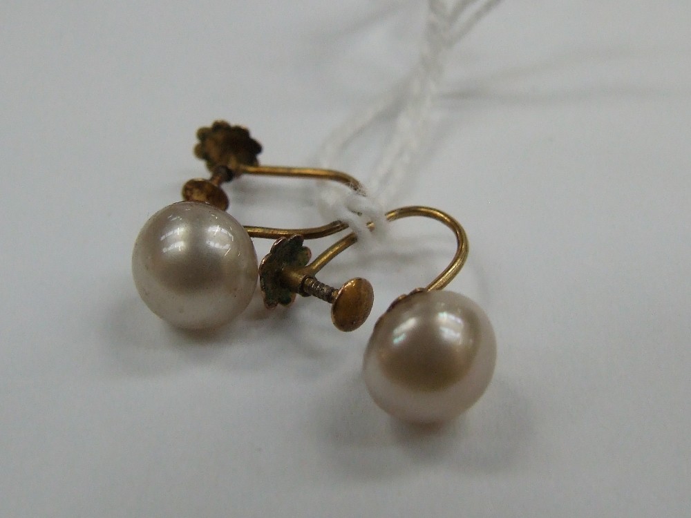 A pair of screw back cultured pearl and 9ct gold earrings