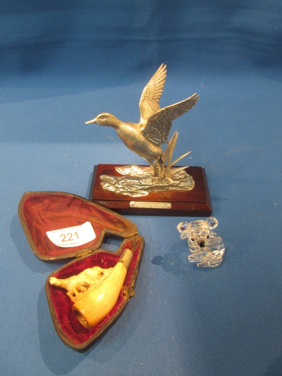 A pewter study of a Mallard duck in flight, a meersham pipe modelled as a horse and a crystal