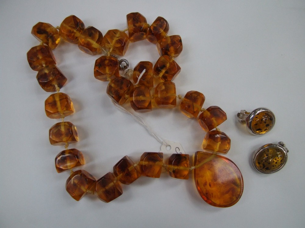 A Baltic Amber style necklace of chunky rough cut design and matched earrings