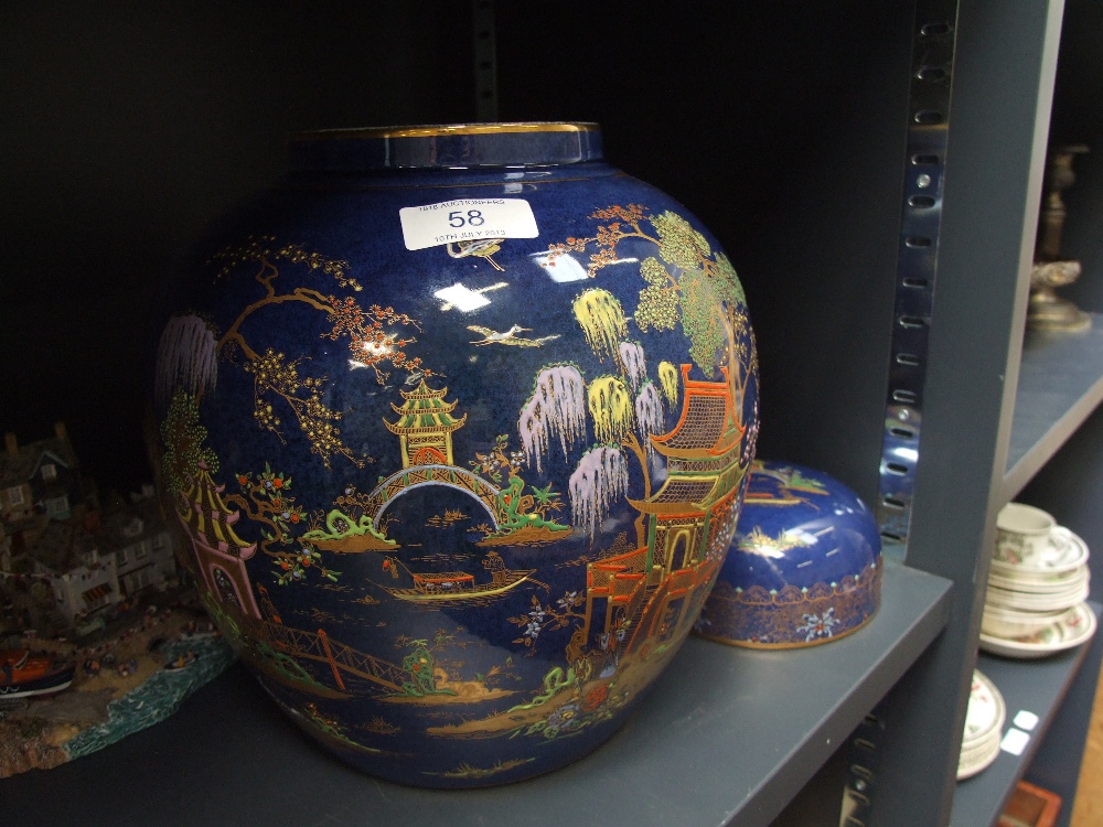 A Carltonware lidded ginger jar having chinoiserie decoration on blue ground