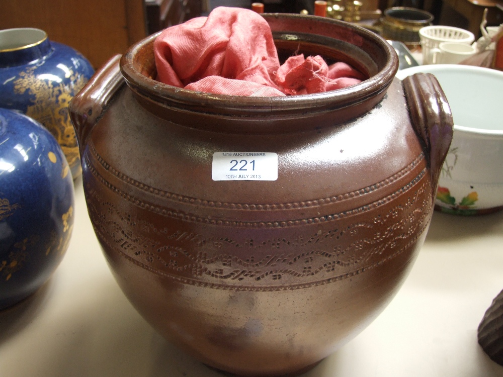 A 19th century stoneware crock pot having salt glaze